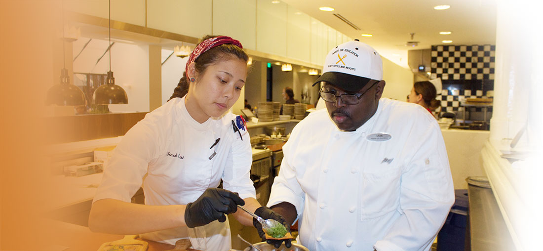 Hotel Chef demonstrating how to plate appetizer to Hands On Education student.
